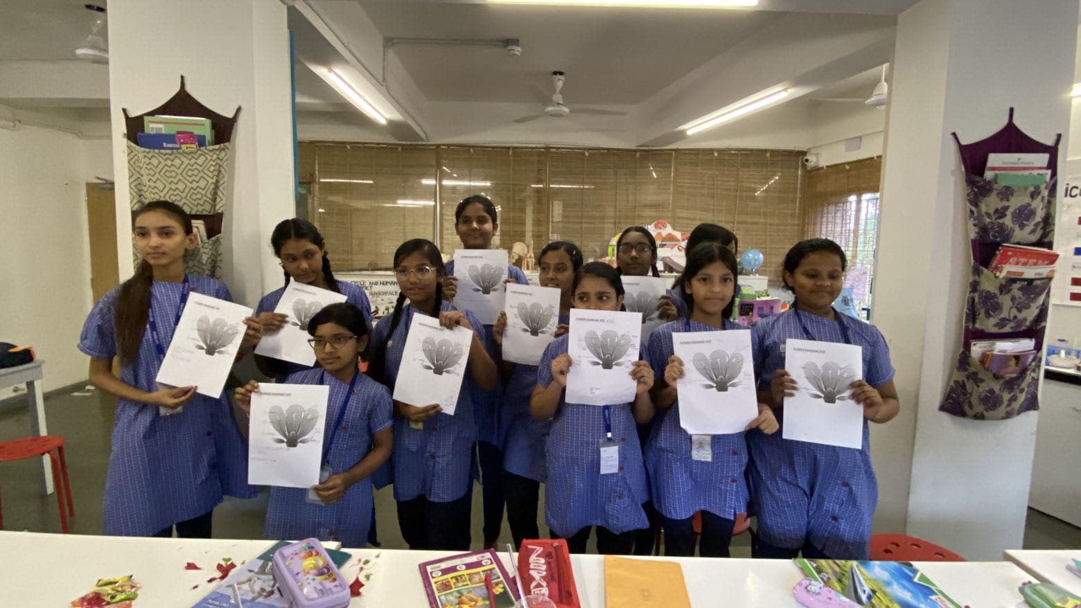 Students showing workshop materials