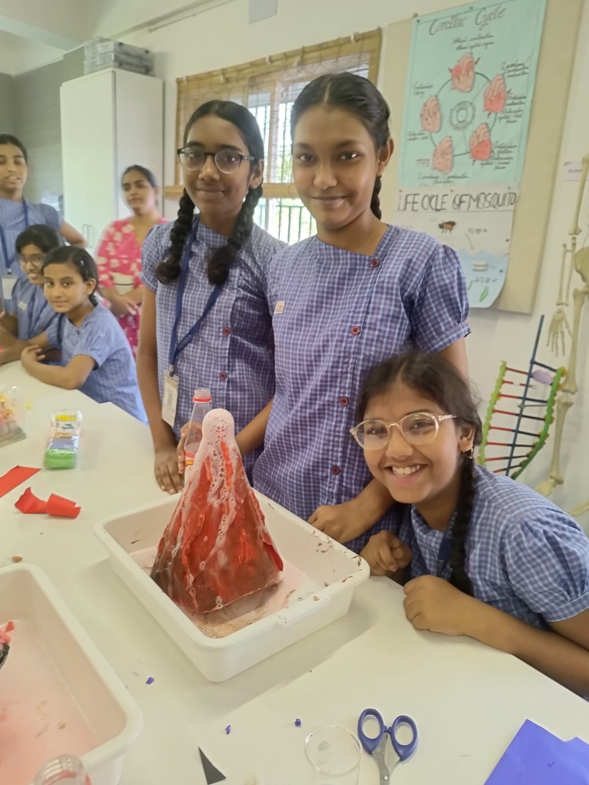 Students conducting a volcano experiment